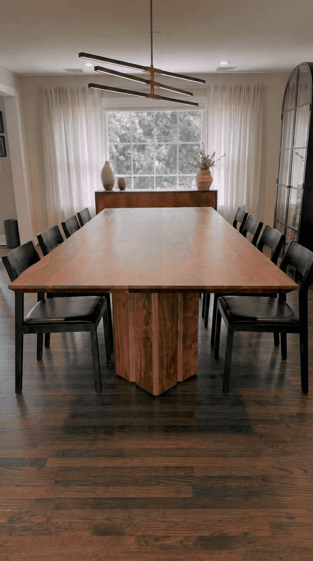 The Vekt Walnut Dining Table in a dining room